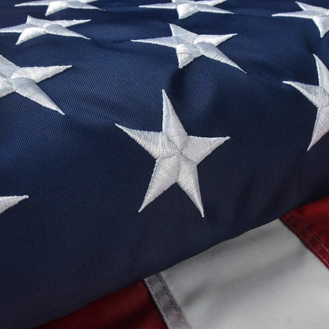 Close-up of embroidered stars on Patriotic 2x3 Ft USA Flag Crafted From Oxford Polyester With Vivid Colors and sewn stripes.