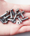 Hand holding Ten Pack Knife Handle Fasteners And Rivets For EDC Pocket Knives, Stainless Steel Bracket Bolts And Tactical Lock Shaft Rivets