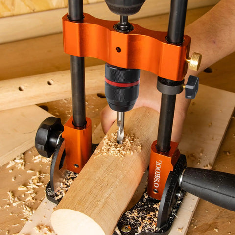 Portable Multi Angle Drill Guide With 60 Degree Adjustable Stand in use on wooden workpiece with shavings