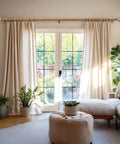 Imitation Wood Grain Leaf Pattern Curtain Rods Set 1 Inch Diameter Adjustable Heavy Duty Boho Drapery Rods For 48 To 84 Inch Windows Natural Wood Finish Finials showing mounted above sliding doors with cream curtains in a living room.