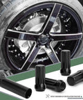 Beefy Black M14x1.5 Spline Lug Nuts Set 2In Long With 60 Degree Taper Includes 7 Point Socket Key Anti Theft Design visible near wheel