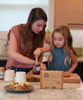 Mother and daughter using Natural Paper Sandwich Bags With Greaseproof Barrier, 48 Count Pack, for lunch preparation in kitchen