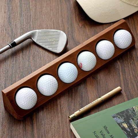 Walnut Wood Golf Ball Display Case 6 Standard Size Wall Mount Holder For Collectors And Golf Fans shown on a wooden surface with golf accessories