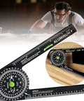 Angled front view of aluminum miter saw protractor with built-in level and ruler, black with white markings