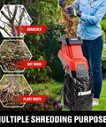 Person using Heavy Duty 15 Amp Wood Chipper Shredder Mulcher With 1.77 Inch Cutting Capacity for shredding branches.