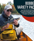 Fisherman holding fish in canoe with Ultimate Fishing Bobber Assortment Pack With Snap On Style Red And White Bobbers