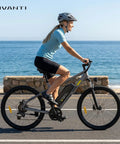 Rider on All Terrain Electric Bike For Adults With 350W Motor Peak 750W near beach, showing 26 inch tires and LCD display