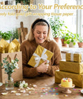 Woman holding gift wrapped with gold metallic tissue paper pack 100 sheets 14 by 20 inches for gift bags and wrapping.