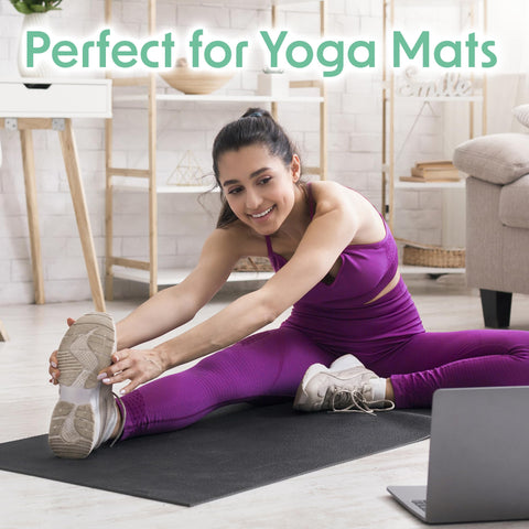 Woman stretching on yoga mat in home gym using Plant Based Gym Wipes For Fitness Equipment Clean And Sanitize With Lemongrass
