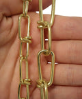 Close-up of 10 Gauge Decorative Solid Steel Double Loop Chain held in hand, sold by the reel, 164 feet, heavy duty hanging chain.
