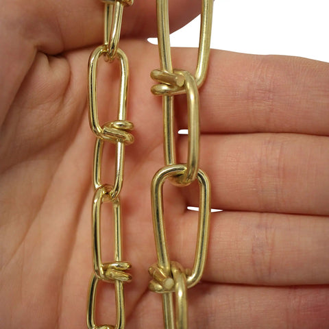 Close-up of 10 Gauge Decorative Solid Steel Double Loop Chain held in hand, sold by the reel, 164 feet, heavy duty hanging chain.