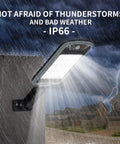 Lit Up Solar Flood Lights Outdoor With 168 LED IP66 mounted on wall in rain, eight-sided design illuminating stormy neighborhood