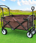 Heavy Duty Foldable Beach Trolley Cart For Camping And Garden Transport with adjustable handle in outdoor setting