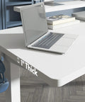 Adjustable Height Standing Desk With Raised Monitor Platform And Sleek Cable Tray For A Sick Home Office Setup. White 1" thick surface with laptop.