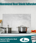 Kitchen with 4-pack aluminized heat shield adhesive mat behind cooking pots, illustrating heat insulation use.