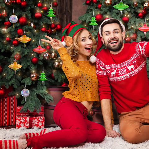 Kick Start Your Festive Craft Game With This 20 Piece Diy Christmas Tree Ornament Woodturning Kit Featuring Smooth Multicolored Wooden Tubes That Are A Straight Up Game Changer For Making Hella Awesome Xmas Decor And Tree Hangings. A couple celebrates near a decorated Christmas tree with colorful ornaments.