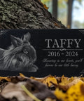 Custom Rabbit Memorial Stone For Outdoor Gardens And Gravesite, black granite with bunny engraving near tree and leaves