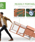 Man moving 96.5-Inch Wooden Chicken Coop With Portable Wheels, Hen House And Nesting Box, demonstrating portability and design.