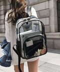 Woman carrying Clear PVC Backpack See Through Bookbag With Front Mesh Pocket And Side Bottle Pockets 12L