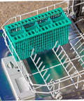 50 Piece Flexible Dishwasher Rack End Covers Tough Vinyl Caps For Prong Guard in dishwasher rack with a green basket.