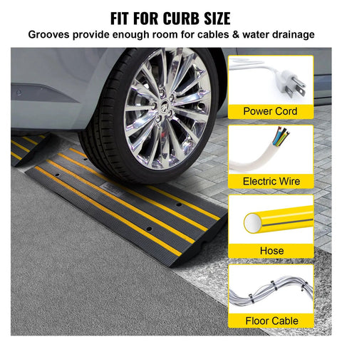 Car wheel on rubber curb ramp set for driveway two pack threshold bridge with reflective safety strips and grooves.