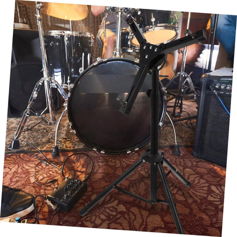Hella Sturdy 12 Fold Snare Drum Stand Rack With Heavy Duty Accessory Holder For Practice Pads And Gear Compact Road Ready Top Shelf Black Finish in a studio.