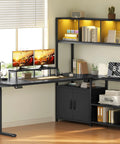 Full On Game Changer Electric Dual Motor L Shaped Standing Desk With Extra Storage Hutch in black, 28 to 45 inches height, with monitor setup.