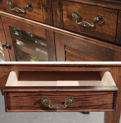 Six Piece Set Of Vintage Drop Bail Drawer Pulls In Antique Bronze Finish installed on wooden cabinet drawers