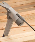 Aluminum Framing Hammer 14 oz with Milled Face, Straight Rip Claw, Shock Reduction Grip showing nail starter on wood surface
