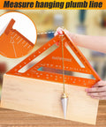 Pro Grade 12 Inch Carpenter Square And Rafter Square With Laser Etched Scale, measuring plumb line on wooden block.