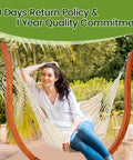 Woman relaxing on Premium Wooden Hammock Stand for Indoor and Outdoor Use, Heavy Duty Solid Wood Frame Supports Up to 500 Lbs, Weather Resistant.