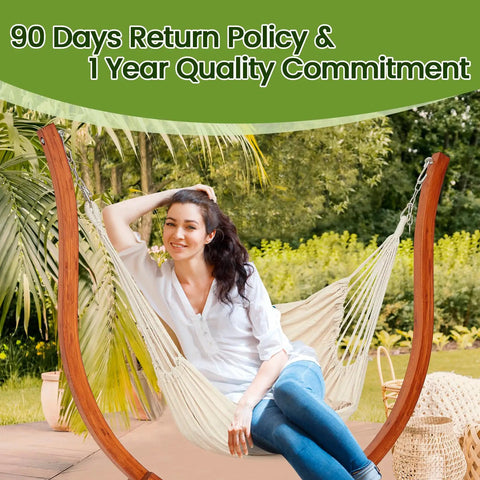 Woman relaxing on Premium Wooden Hammock Stand for Indoor and Outdoor Use, Heavy Duty Solid Wood Frame Supports Up to 500 Lbs, Weather Resistant.