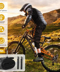 Mountain biker with Two Pack 29 Inch Bike Tube With 48mm Presta Valve, plus tire levers, in rugged outdoor setting