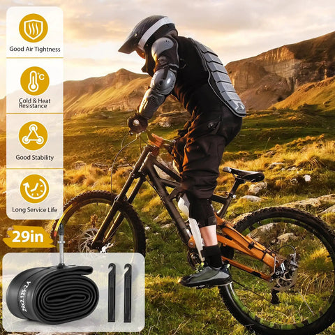 Mountain biker with Two Pack 29 Inch Bike Tube With 48mm Presta Valve, plus tire levers, in rugged outdoor setting