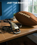Epic Kids RC Helicopter With 360 Degree Propeller Protection, Altitude Hold And Gyro Stabilization next to a football for scale
