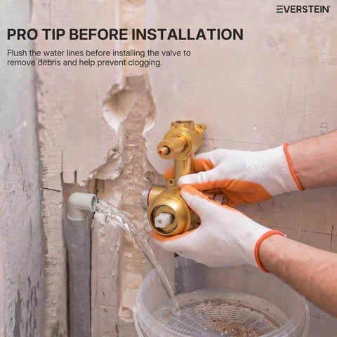 Installation tip for EVERSTEIN Shower System with Handheld Spray, showcasing a brass valve being flushed.