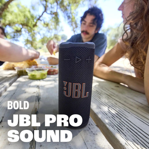 Grip Compact Bluetooth Speaker With Bold Pro Sound and Ambient Light for On The Go Vibes, next to people outdoors