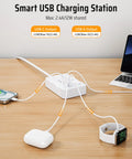 Heavy Hitter Power Strip Surge Protector With Six Wide Spread Outlet Plugs And Four Fast Charge USB Ports Including Dual Type C Inputs charging multiple devices on a wooden desk.