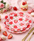 Totally Dope Pink Plaid Strawberry Print Disposable Paper Plates 60 Pack With 9 And 7 Inch Sizes on a dessert table.