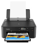 Front view of PIXMA TS702a Wireless Single Function Printer With AirPrint And Mopria, black color with paper loaded