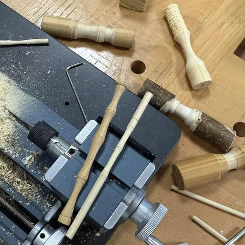 EssSthmy 36W Mini Metal Lathe With 20000 RPM for fast woodworking DIY crafting, showing detailed wood pieces on lathe.