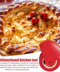 Red pastry wheel cutter with crinkle roller for lattice pie crust, shown beside baked pie