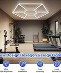 Dual Hex LED Garage Light Ceiling Fixture For Workshop And Gym 114W 14250LM 6500K Daylight White Pro Grade Build Honeycomb Hexagon Design Perfect For Garage Barbershop Office And Hobby Space installed in a gym.