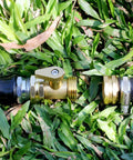 Heavy Duty Brass Garden Hose Shut Off Valve 3 Quarter Inch Male To Female Connector Set installed on hose in grass