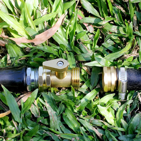 Heavy Duty Brass Garden Hose Shut Off Valve 3 Quarter Inch Male To Female Connector Set installed on hose in grass