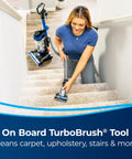 Woman using Straight Up Powerful Upright Vacuum Cleaner With Extending Wand and Massive Dust Bin for cleaning stairs.