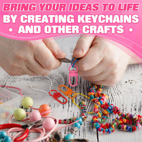 Hands using pliers to create keychains with vibrant Premium Metal Lobster Clasps With Smooth Rollin Rings For Custom Keychains And Craft Supplies.