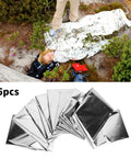 Person using Emergency Survival Reflective Blanket For Camping And Hiking Packable Thermal Shield; 5 pack shown.