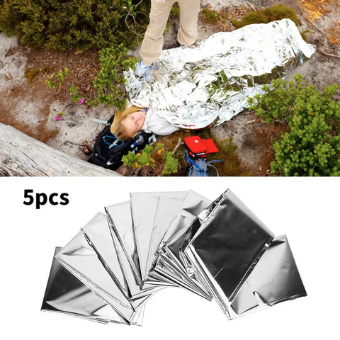Person using Emergency Survival Reflective Blanket For Camping And Hiking Packable Thermal Shield; 5 pack shown.