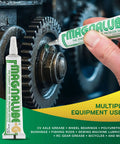 Applying All Purpose PTFE Grease for Bearings, Axles, Reels, and Fishing Gear to machinery gear with lubricant tube.